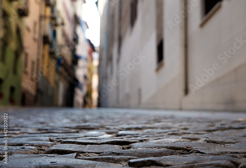 Close up view of old historic cobble in a street in Pamplona.