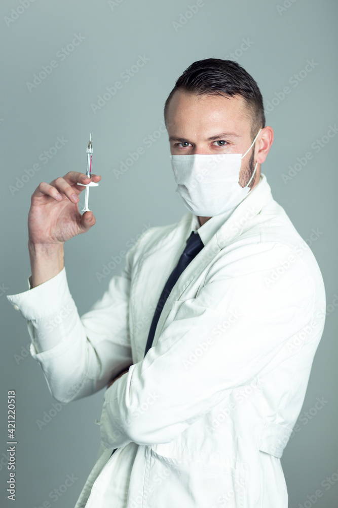 Portrait of doctor with vaccine
