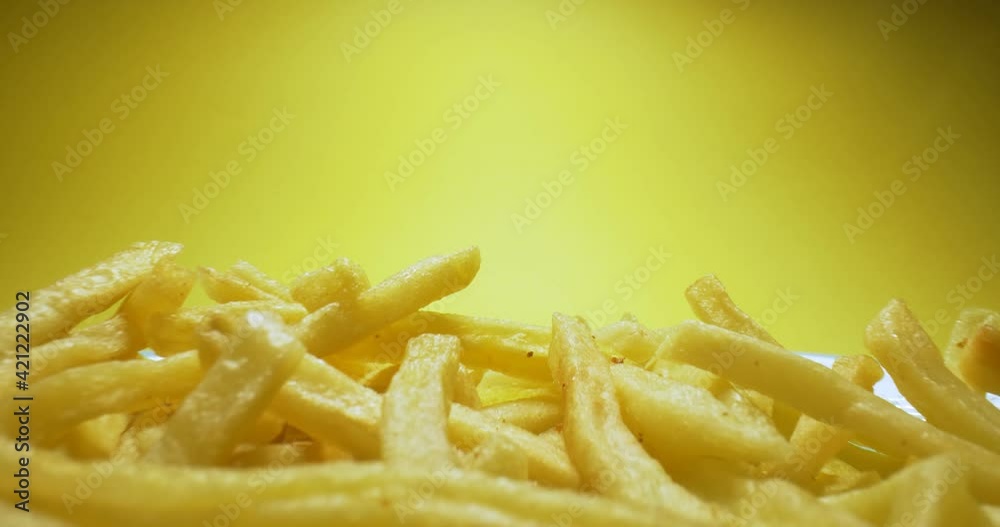 detailed extreme close-up of hot fries with smoke on yellow background. detailed extreme close-up of hot fries with smoke on yellow background.