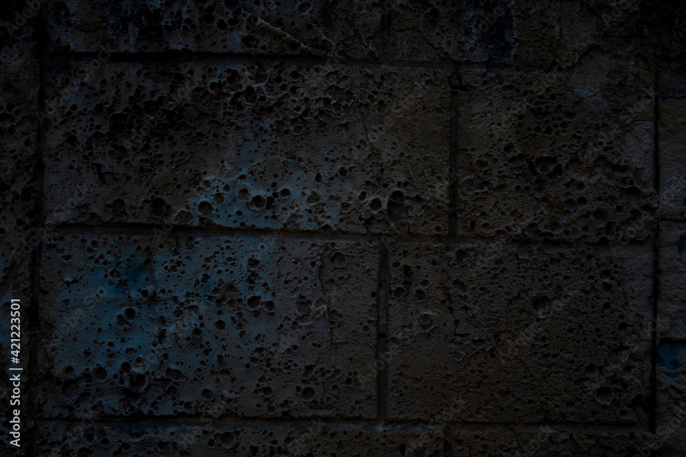 Fototapeta premium texture of a grey stone wall covered, space for text, space for copy