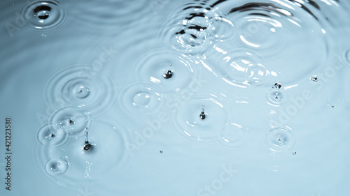 Water drops falling on wate...