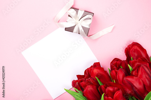 Greeting Card mockup beautiful tulips and place for text. Flat lay template with copy space. Photography for design.