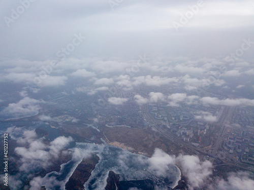 Aerial high view. Flight over the clouds of Kiev.