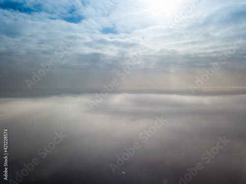 Aerial high view. Flying over the clouds.