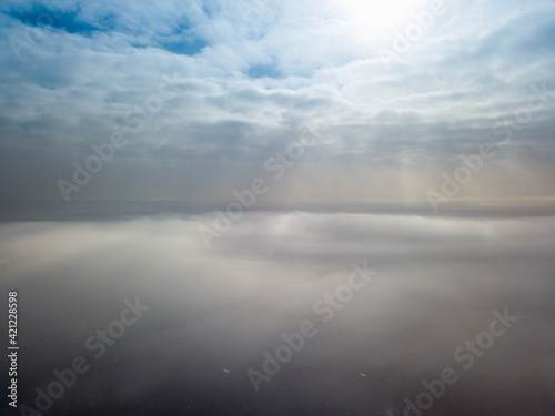 Aerial high view. Flying over the clouds.