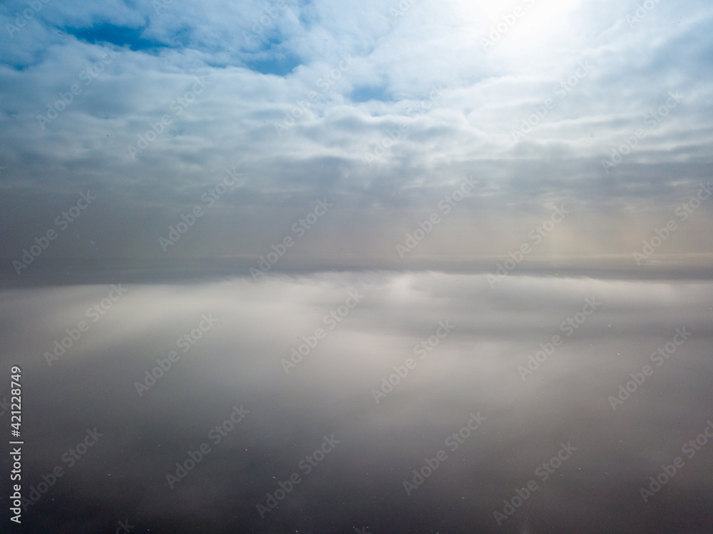 Aerial high view. Flying over the clouds.