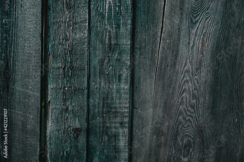 Old wooden fence with shabby paint. Background. Wood texture