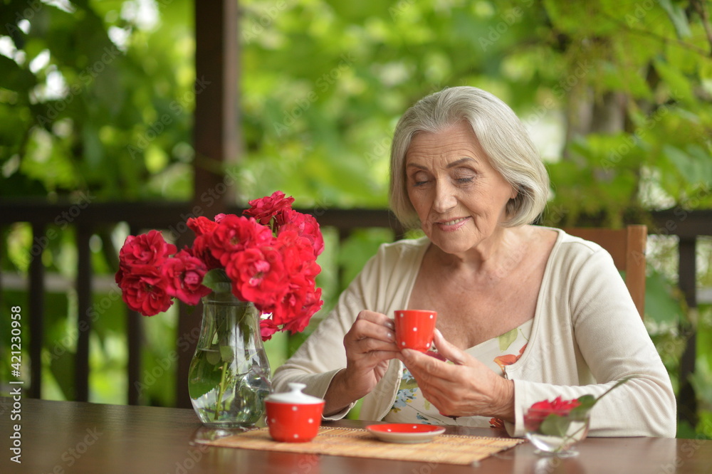 Portrait of a happy senior woman drinking coffee Portrait of a happy senior woman drinking coffee