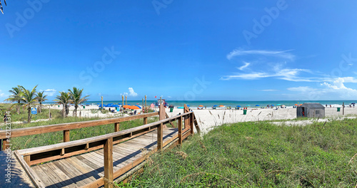 Fototapeta Naklejka Na Ścianę i Meble -  View of the beach from the boardwalk at Cocoa Beach Florida during Spring Break in Brevard County on the Space Coast. 