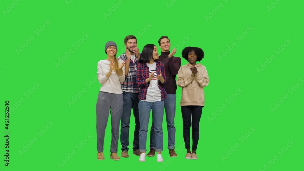 Young people waiting to hear the results, approving of what they hear and start clapping happily on a Green Screen, Chroma Key. Young people waiting to hear the results, approving of what they hear and start clapping happily on a Green Screen, Chroma Key.
