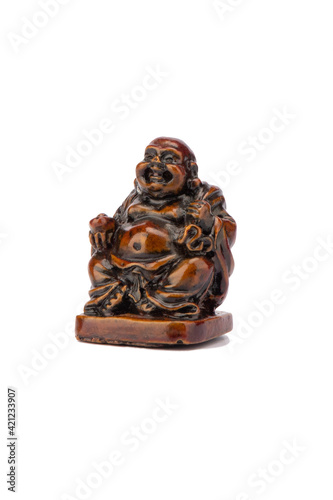 Netsuke Hotei (Budai) isolated on white background. God of communication, fun and well-being. Statue japanese god mascot