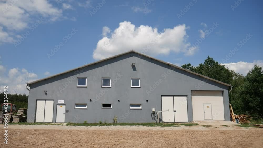 Just an cowshed standing alone on the sunny day Just an cowshed standing alone on the sunny day