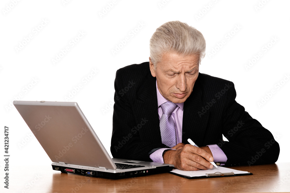 Old businessman working with laptop Old businessman working with laptop