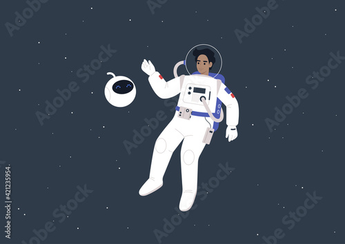 Fotografia A young male astronaut in a spacesuit and a cute round robot floating in outer s