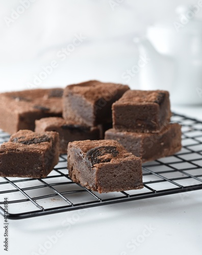 Homemade fudgy chocolate brownies on white background.