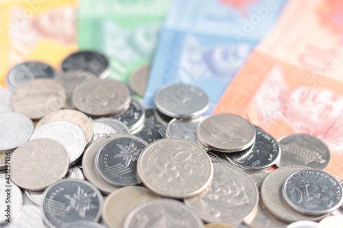 close up view of Malaysian Ringgit MYR coins currency, cents, banknote, paper money. selective focus.