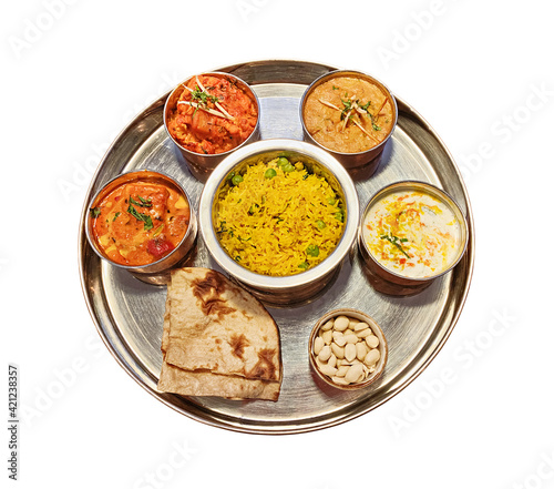 Typical Indian dish thali isolated on white background.