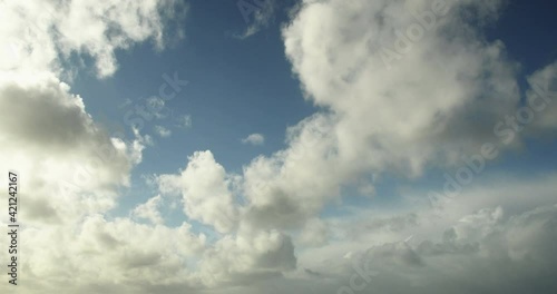 Timelapse of white cumulus obscuring the sky. Natural colors - 4K footage video.