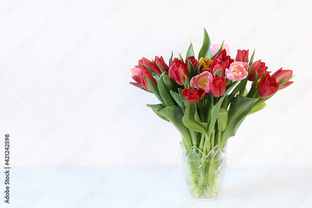 Beautiful bouquet with multicolored tulips in vase copy space Beautiful bouquet with multicolored tulips in vase copy space