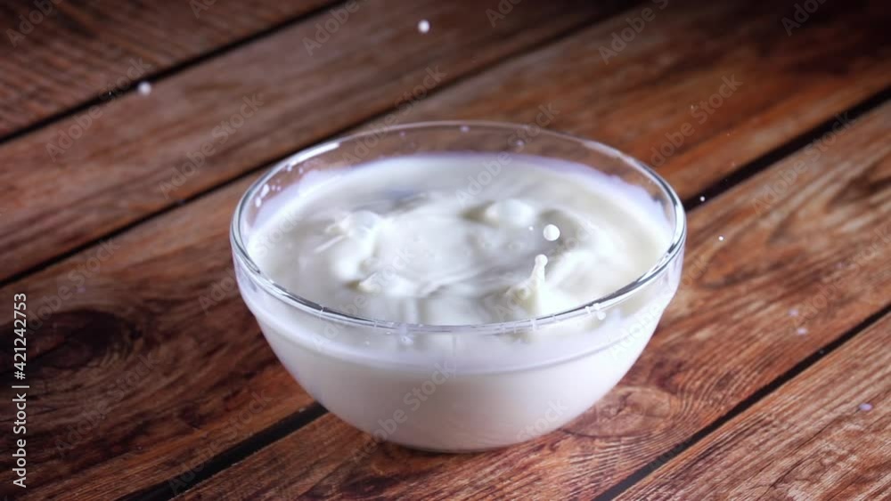 Blueberry Berries Fall Into Milk. Slow Motion Blueberry Berries Fall Into Milk. Slow Motion