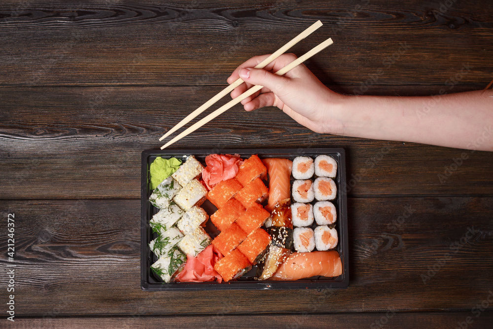 chopsticks sushi rolls asian cuisine wooden table ginger wasabi chopsticks sushi rolls asian cuisine wooden table ginger wasabi