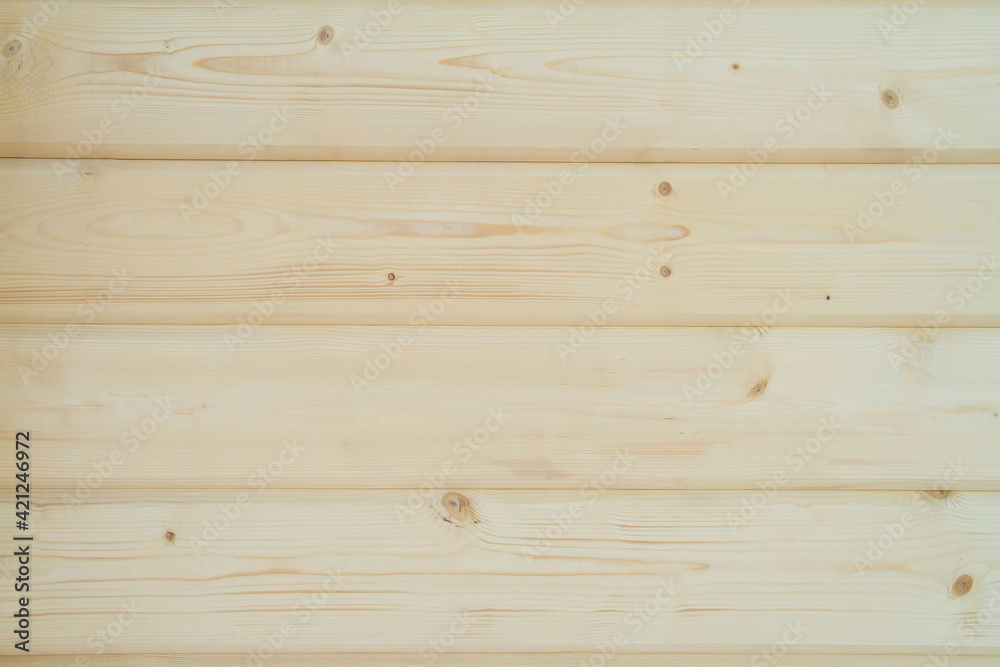 Fototapeta premium Building a house from a wooden beams. wall of wooden glued beams. Eco House construction. Pine beams. Timber. Wooden background.