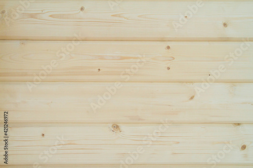 Building a house from a wooden beams. wall of wooden glued beams. Eco House construction. Pine beams. Timber. Wooden background.