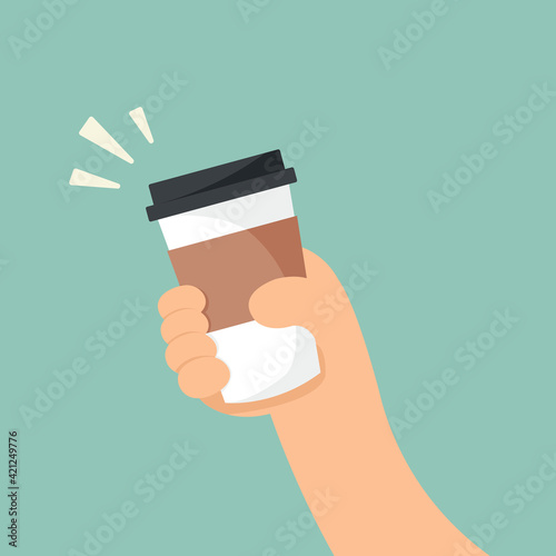 hand holding glass of hot drink concept.