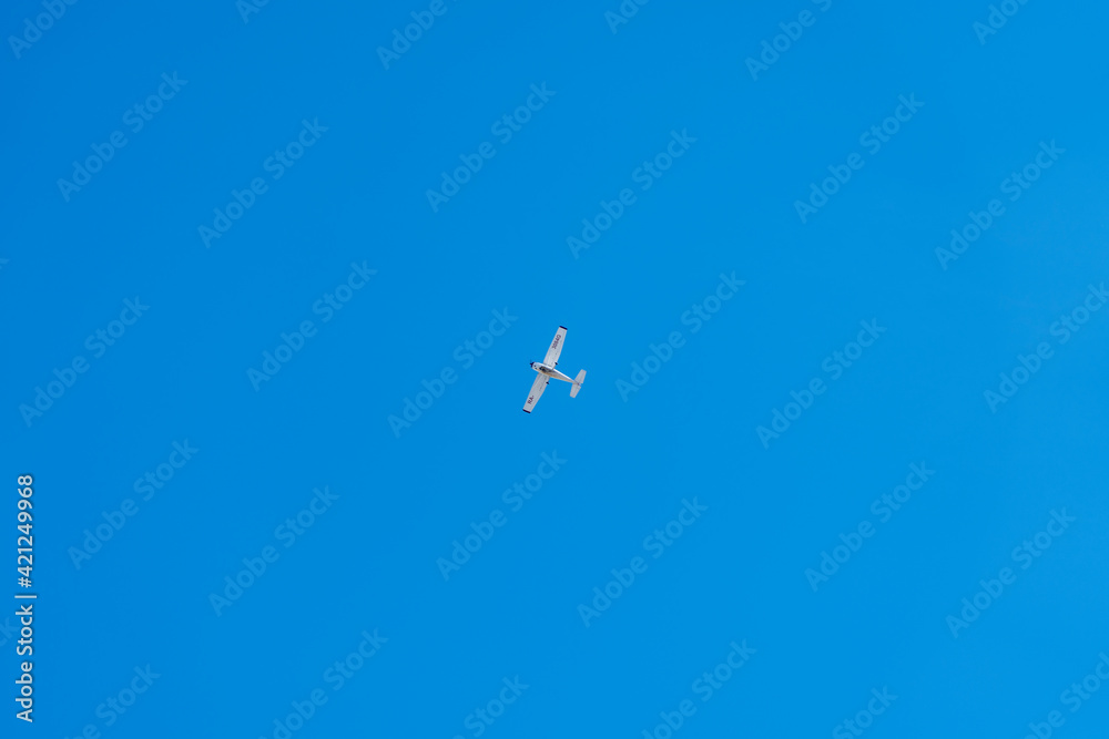 a pleasure plane in a clear blue sky a pleasure plane in a clear blue sky