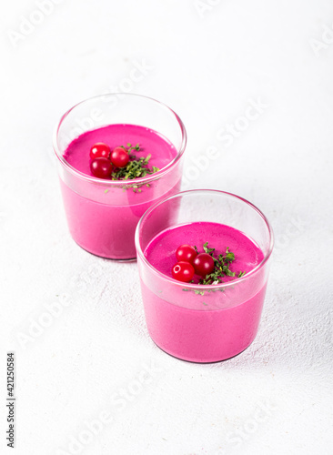 Jelly beet cranberry in a glass on a white background