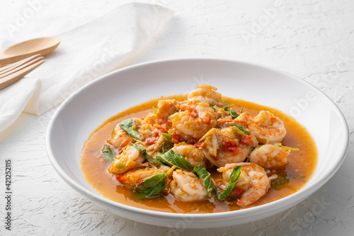 Stir fried shrimp with basil on white plate,thai spicy food