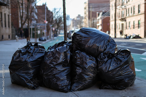 Photography Black Garbage Bags Filled with Trash along the Street in Astoria Queens New York