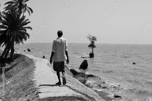 Photography On the mud embankment of the island of Ghoramara in the Indian Sundarbans