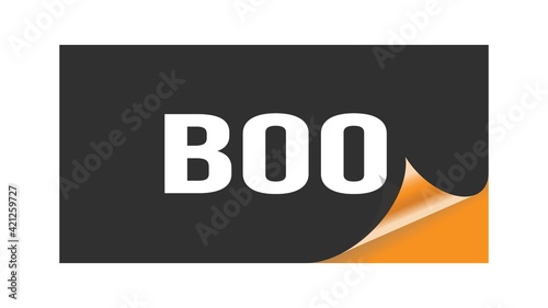 BOO text written on black orange sticker.