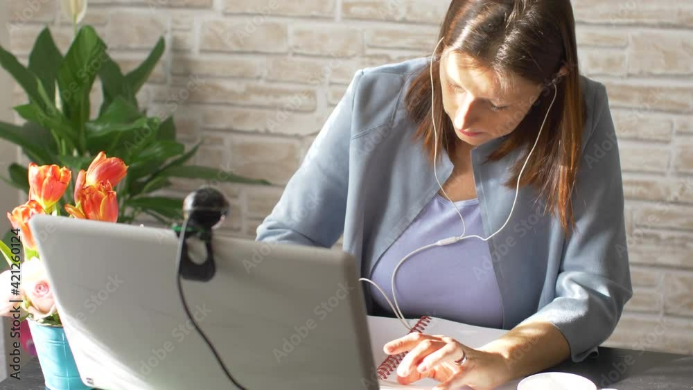 Business woman typing on laptop computer working at home using  internet. Female professional working notebook at home