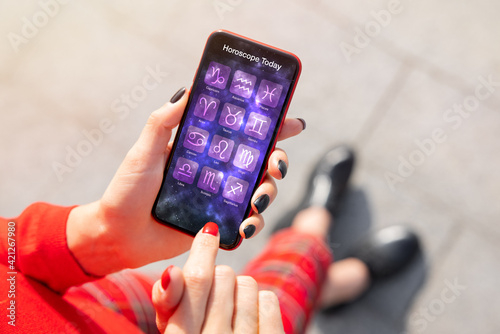 Canvastavla Person using astrology app on phone and reading daily horoscopes