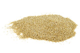 Small pile of raw white quinoa seeds