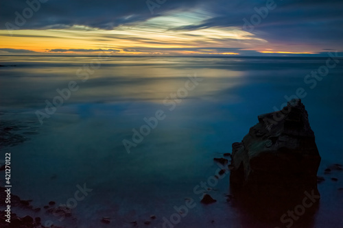 Overcast Sunset on Rocky Cliffs