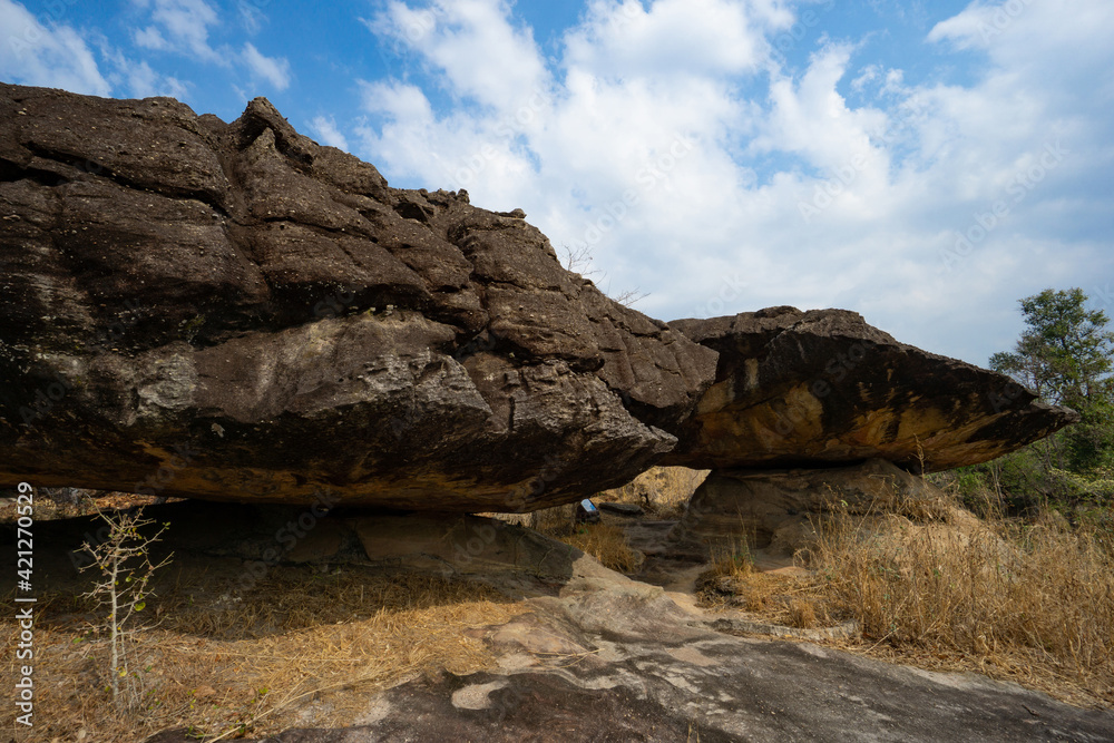 Phu Pha Thoep National Park a small protected area in Mukdahan Province east of Thailand near the border to Laos with cloudy blue sky background Phu Pha Thoep National Park a small protected area in Mukdahan Province east of Thailand near the border to Laos with cloudy blue sky background