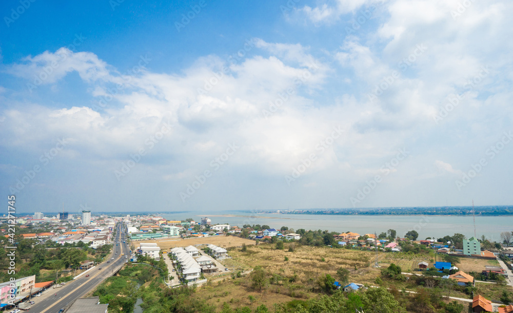 Mukdahan, Thailand - February 14, 2020; Panoramic view of Mukdahan province in Thailand with cloudy blue sky background