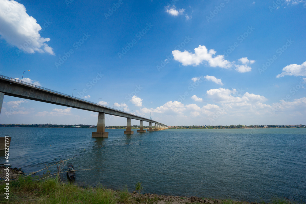 Landscape ofThai-Laos Friendship Bridge II Viewpoint at Mekong river in cloudy blue sky background