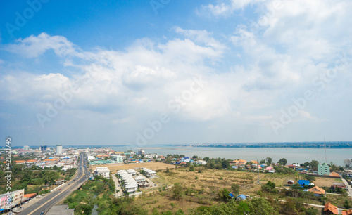 Mukdahan, Thailand - February 14, 2020; Panoramic view of Mukdahan province in Thailand with cloudy blue sky background