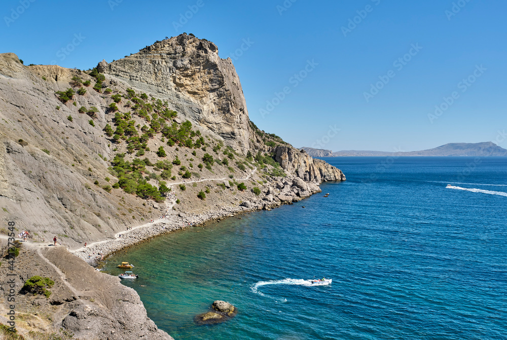 Fototapeta premium Crimean peninsula. People walk along the tourist route Golitsyn Trail. Botanical reserve New World.