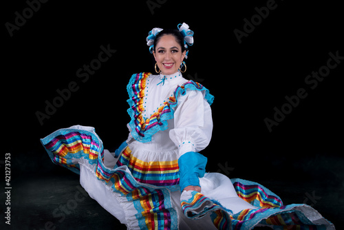 Latin woman dressed in a dress from Jalisco Mexico,