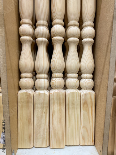 wooden balusters on the rack in the store. detail of a column