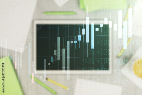 Abstract creative financial graph and modern digital tablet on background, top view, forex and investment concept. Multiexposure © Pixels Hunter