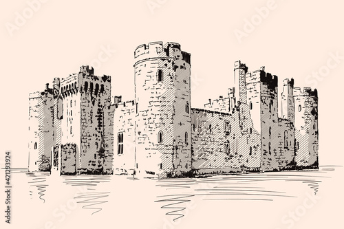 Medieval stone castle with towers and arches on the sea shore. Fototapet
