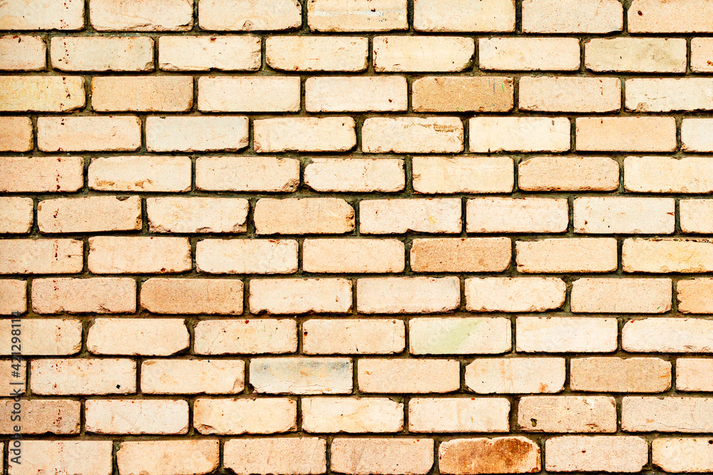 Obraz premium Texture of a brick wall with cracks and scratches which can be used as a background