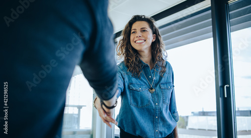 Employer shaking hands with job candidate