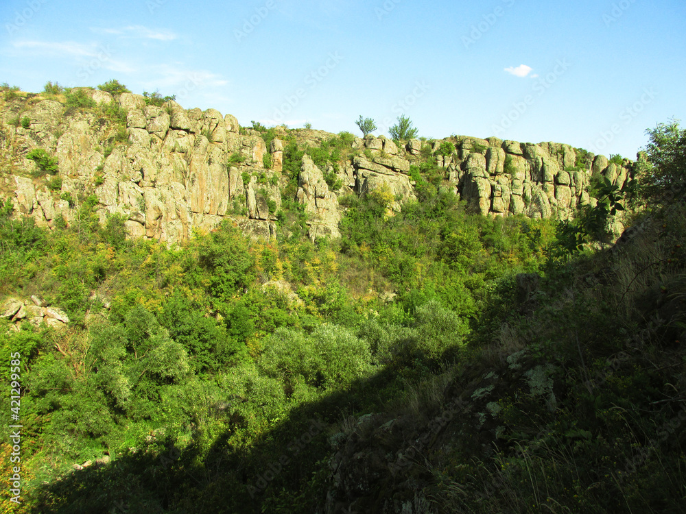 Stone mountains with green vegetation 